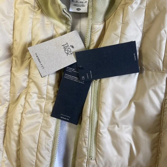 NWT Woman Nike Therma-FIT Tech Pack Long Puffer Jacket Gold Sz S Reg $200